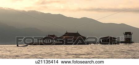 Picture - Small Island with huts on Inle Lake. Fotosearch