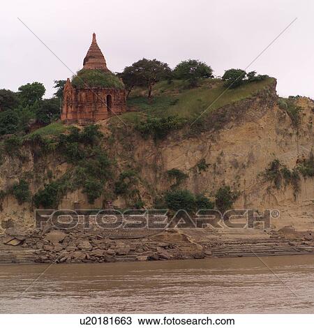 Stock Image - Temple at the edge of a cliff. Fotosearch