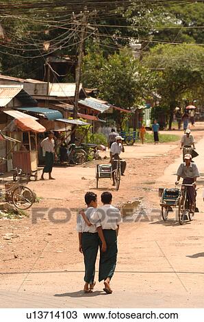Stock Image - Two young Burmese boys walking. Fotosearch