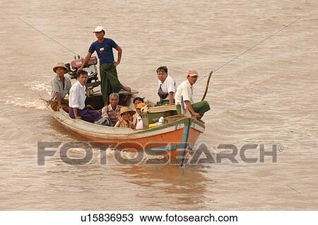 Stock Image - Boat on the Irrawaddy River. Fotosearch