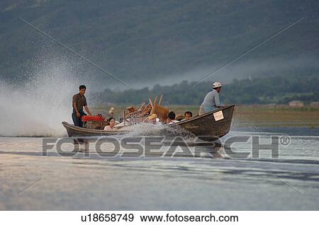 Family in motorized boat View Large Photo Image Stock Photo - Family in motorized boat. Fotosearch