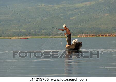 Stock Photography - Fisherman in row boat. Fotosearch