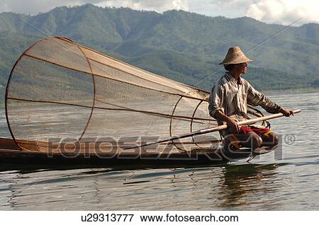 Fisherman in row boat - upclose View Large Photo Image Stock Photo - Fisherman in row boat - upclose. Fotosearch