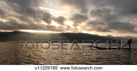 Stock Photo - Fisherman leg rowing. Fotosearch