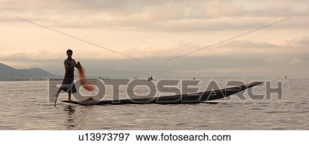 Fisherman leg rowing View Large Photo Image Stock Photo - Fisherman leg rowing. Fotosearch