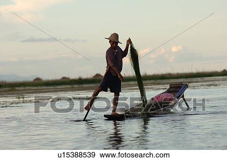 Fisherman leg rowing View Large Photo Image Stock Photo - Fisherman leg rowing. Fotosearch