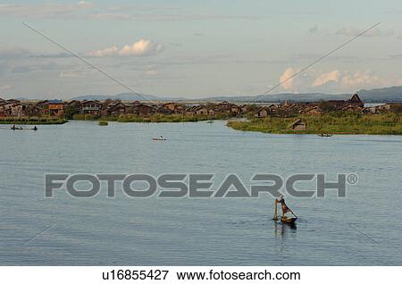 Fisherman leg rowing View Large Photo Image Stock Photo - Fisherman leg rowing. Fotosearch