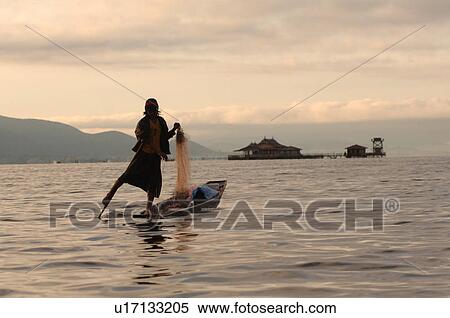 Fisherman leg rowing View Large Photo Image Stock Photography - Fisherman leg rowing. Fotosearch
