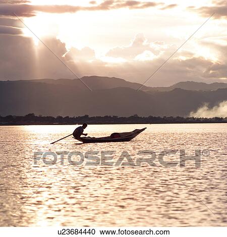 Intha fisherman in his flat-bottomed boat View Large Photo Image Stock Image - Intha fisherman in his flat-bottomed boat. Fotosearch