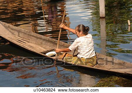 Woman in row boat View Large Photo Image Picture - Woman in row boat. Fotosearch