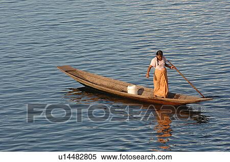 Woman in row boat View Large Photo Image Stock Photography - Woman in row boat. Fotosearch