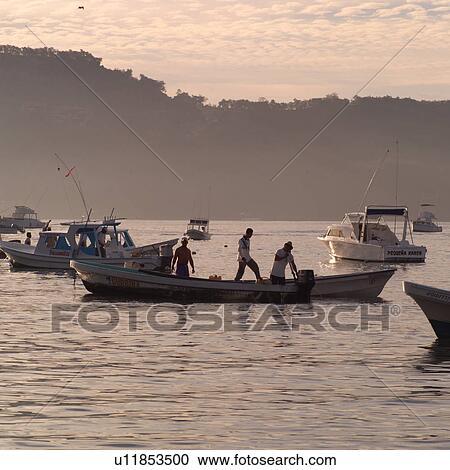 Stock Image - Boats off the coast of Ixtapa. Fotosearch