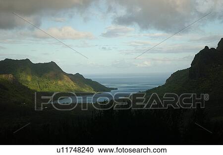 Stock Image - Panoramic view of the ocean seen from a hill, Moorea, Tahiti, French Polynesia, South Pacific. Fotosearch