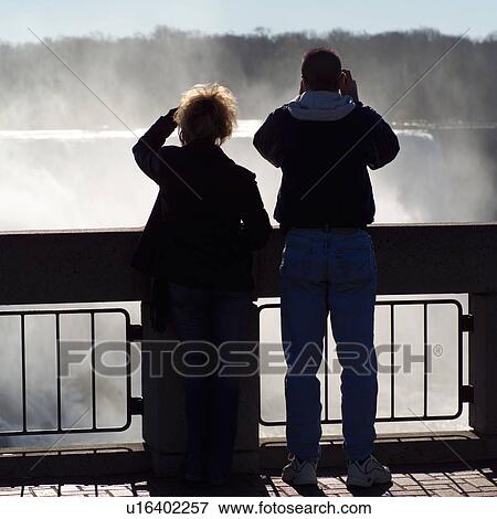 Stock Photo - people viewing Niagara Falls - Ontario Canada. Fotosearch