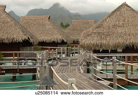 Thatched roof structures of a seaside resort View Large Photo Image Picture - Thatched roof structures of a seaside resort. Fotosearch