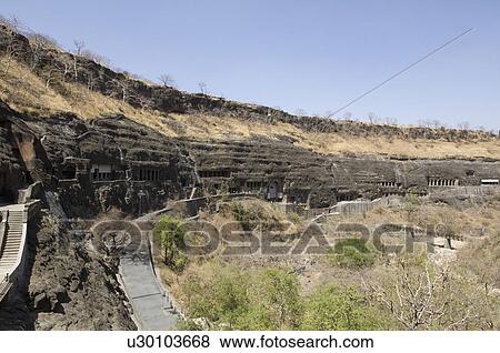Stock Photo - Blue sky over caves, Ajanta, Maharashtra, India. Fotosearch