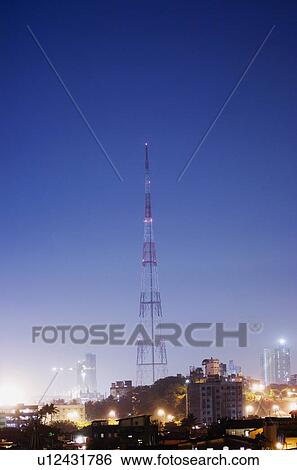 Buildings and a tower lit up at night, Mumbai, Maharashtra, India View Large Photo Image Stock Photograph - Buildings and a tower lit up at night, Mumbai, Maharashtra, India. Fotosearch