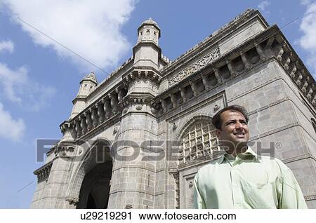 Low angle view of a businessman standing in front of a monument, Gateway of India, Mumbai, Maharashtra, India View Large Photo Image Stock Image - Low angle view of a businessman standing in front of a monument, Gateway of India, Mumbai, Maharashtra, India. Fotosearch