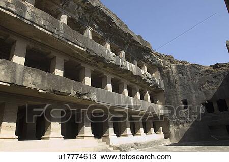 Stock Image - Low angle view of a cave, Teen Taal, Ellora, Aurangabad, Maharashtra, India. Fotosearch
