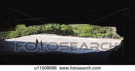 High angle view of two tourists in a cave, Kanari Cave, Mumbai, Maharashtra, India View Large Photo Image Stock Photograph - High angle view of two tourists in a cave, Kanari Cave, Mumbai, Maharashtra, India. Fotosearch