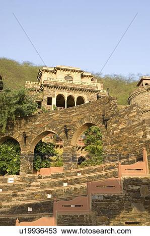 Stock Image - Low angle view of a fort behind an amphitheater, Neemrana Fort, Neemrana, Alwar, Rajasthan, India. Fotosearch
