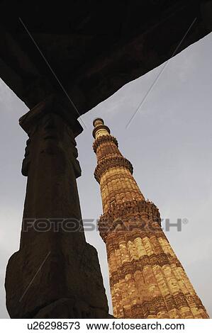 Stock Image - Low angle view of a monument, Qutub Minar, New Delhi, India. Fotosearch