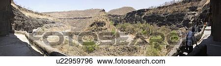 Tourist walking towards a cave, Ajanta, Maharashtra, India View Large Photo Image Stock Photograph - Tourist walking towards a cave, Ajanta, Maharashtra, India. Fotosearch