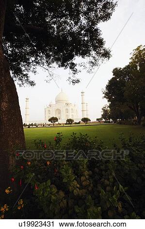 Stock Image - Garden in front of a mausoleum, Taj Mahal, Agra, Uttar Pradesh, India. Fotosearch
