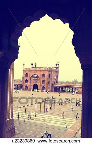 Stock Photo - High angle view of a group of people in the courtyard of a mosque, Jama Masjid, New Delhi, India. Fotosearch