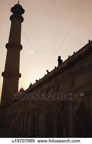 Low angle view of an ornate wall leading to a minaret, Taj Mahal, Agra, Uttar Pradesh, India View Large Photo Image Stock Photo - Low angle view of an ornate wall leading to a minaret, Taj Mahal, Agra, Uttar Pradesh, India. Fotosearch