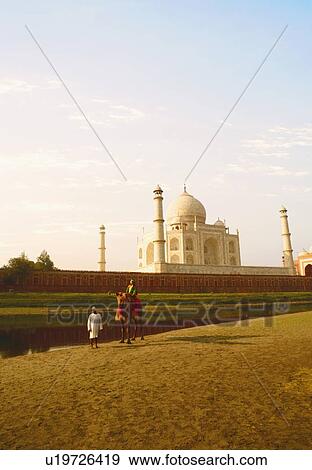 Mature man standing with a young man sitting on a camel, Taj Mahal, Agra, Uttar Pradesh, India View Large Photo Image Stock Photo - Mature man standing with a young man sitting on a camel, Taj Mahal, Agra, Uttar Pradesh, India. Fotosearch