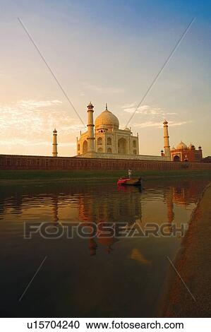 Stock Image - Mausoleum near a river, Taj Mahal, Agra, Uttar Pradesh, India. Fotosearch