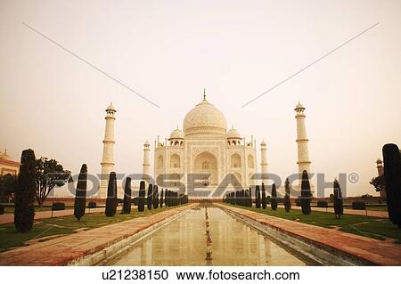 Stock Image - Pond in front of a mausoleum, Taj Mahal, Agra, Uttar Pradesh, India. Fotosearch