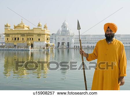 Portrait of a Sikh guard holding a spear, Golden Temple, Amritsar, Punjab, India View Large Photo Image Stock Photo - Portrait of a Sikh guard holding a spear, Golden Temple, Amritsar, Punjab, India. Fotosearch