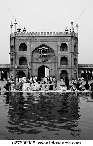 Rear view of a group of people sitting outside a mosque, Jama Masjid, New Delhi, India View Large Photo Image Stock Photography - Rear view of a group of people sitting outside a mosque, Jama Masjid, New Delhi, India. Fotosearch