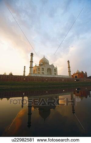 Stock Image - Reflection of a mausoleum in water, Taj Mahal, Agra, Uttar Pradesh, India. Fotosearch