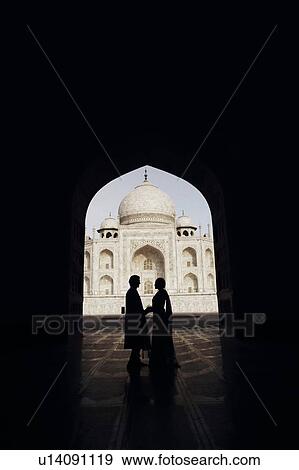 Silhouette of a couple standing in front of a mausoleum, Taj Mahal, Agra, Uttar Pradesh, India View Large Photo Image Stock Photo - Silhouette of a couple standing in front of a mausoleum, Taj Mahal, Agra, Uttar Pradesh, India. Fotosearch