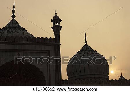 Stock Image - Silhouette of a mosque at sunset, Jama Masjid, New Delhi, India. Fotosearch