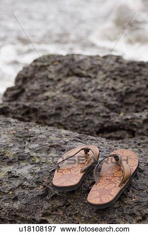 Close-up of a pair of flip-flops on the beach View Large Photo Image Stock Photo - Close-up of a pair of flip-flops on the beach. Fotosearch