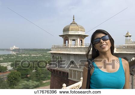 Close-up of a young woman smiling, Taj Mahal, Agra, Uttar Pradesh, India View Large Photo Image Stock Photograph - Close-up of a young woman smiling, Taj Mahal, Agra, Uttar Pradesh, India. Fotosearch