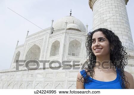 Close-up of a young woman smiling, Taj Mahal, Agra, Uttar Pradesh, India View Large Photo Image Stock Photography - Close-up of a young woman smiling, Taj Mahal, Agra, Uttar Pradesh, India. Fotosearch