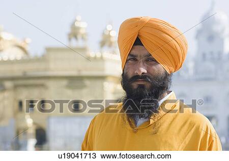 Portrait of a mid adult man, Golden Temple, Amritsar, Punjab, India View Large Photo Image Stock Image - Portrait of a mid adult man, Golden Temple, Amritsar, Punjab, India. Fotosearch