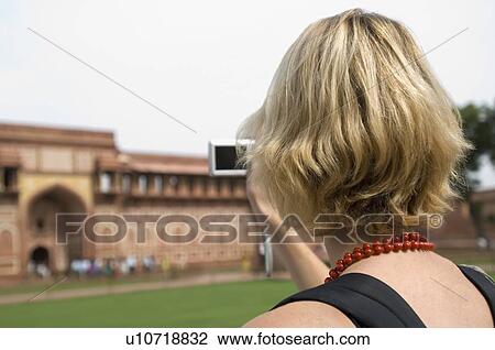 Rear view of a young woman taking a picture with a digital camera, Taj Mahal, Agra, Uttar Pradesh, India View Large Photo Image Stock Image - Rear view of a young woman taking a picture with a digital camera, Taj Mahal, Agra, Uttar Pradesh, India. Fotosearch