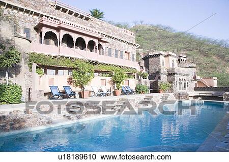Stock Image - Swimming pool in front of a fort. Fotosearch