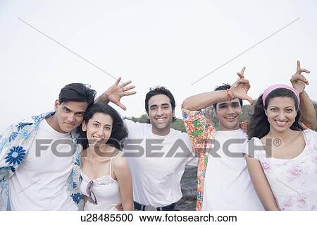 Portrait of three young men and two young women having fun View Large Photo Image Stock Image - Portrait of three young men and two young women having fun. Fotosearch