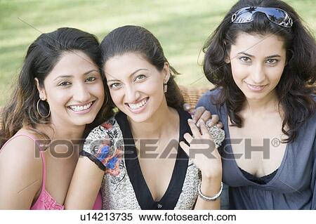 Stock Photography - Portrait of three young women smiling. Fotosearch