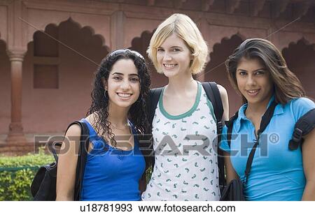 Portrait of three young women standing together and smiling, Taj Mahal, Agra, Uttar Pradesh, India View Large Photo Image Stock Image - Portrait of three young women standing together and smiling, Taj Mahal, Agra, Uttar Pradesh, India. Fotosearch