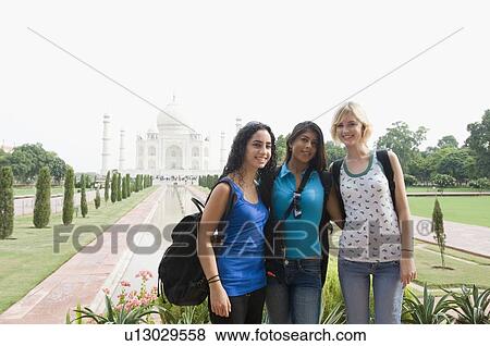 Portrait of three young women standing together and smiling, Taj Mahal, Agra, Uttar Pradesh, India View Large Photo Image Stock Photo - Portrait of three young women standing together and smiling, Taj Mahal, Agra, Uttar Pradesh, India. Fotosearch
