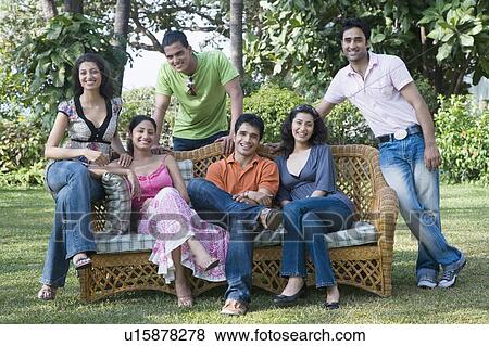 Three young couples smiling in a lawn View Large Photo Image Stock Photo - Three young couples smiling in a lawn. Fotosearch