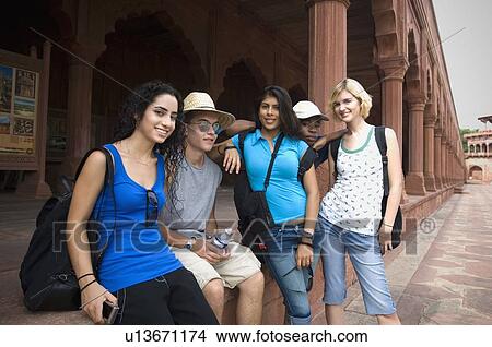 Three young women smiling with their friends, Taj Mahal, Agra, Uttar Pradesh, India View Large Photo Image Picture - Three young women smiling with their friends, Taj Mahal, Agra, Uttar Pradesh, India. Fotosearch